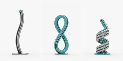 Three Abstract Metallic Sculptures On White Background