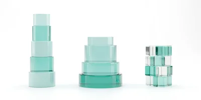 Three Abstract Glass Geometric Sculptures On White Background