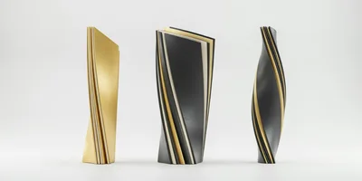 Three Abstract Modern Sculptures On White Background