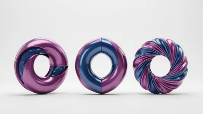 Three Abstract Metallic Torus Shapes On White Background
