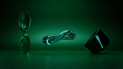 Abstract Glass Sculptures On A Dark Green Background