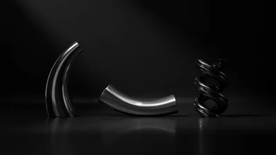 Abstract Metallic Sculptures On Dark Reflective Surface