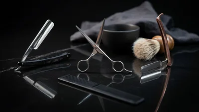 Professional Barber Tools on Black Marble Surface