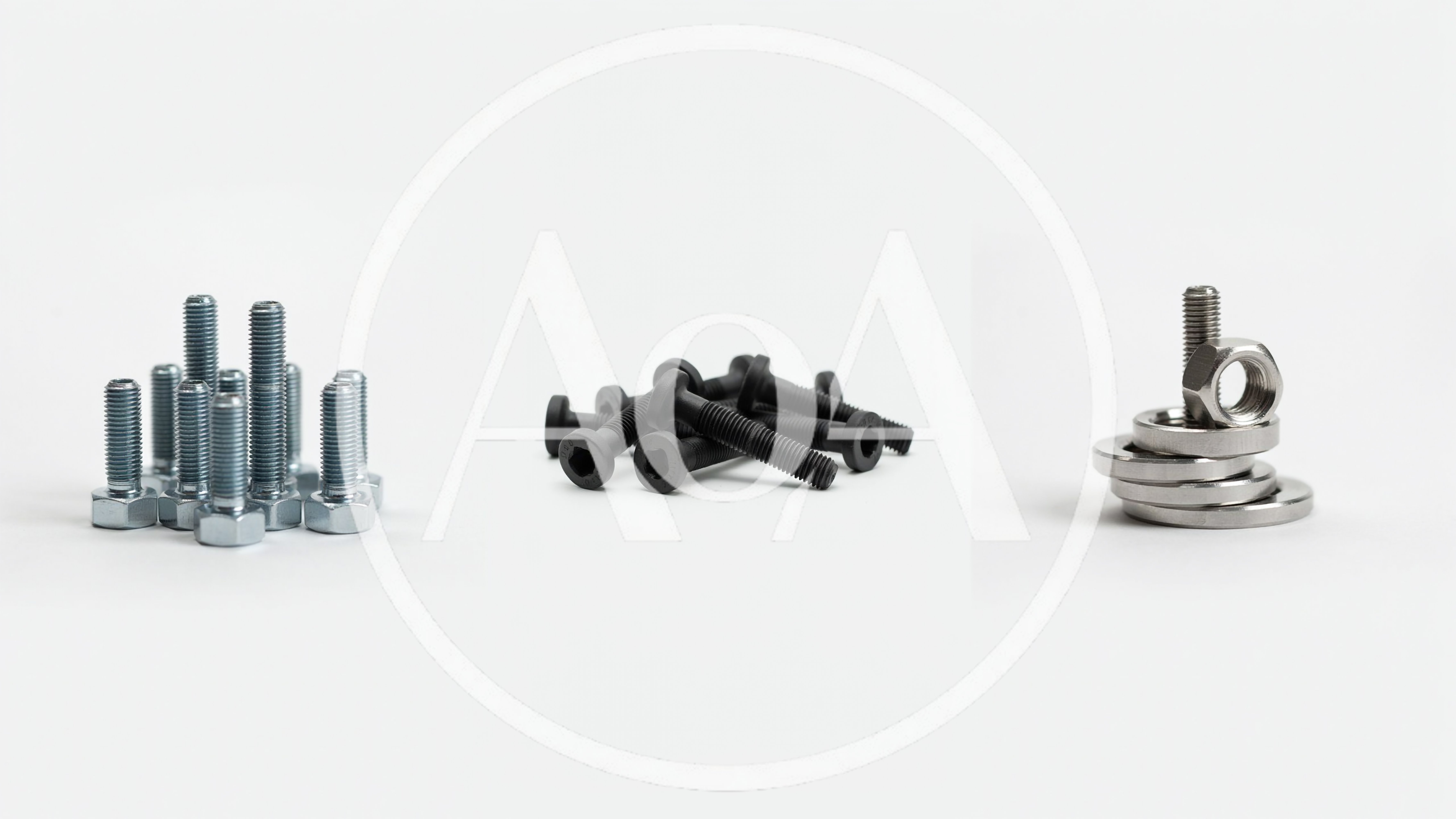 Assorted Metal Bolts And Washers On White Background