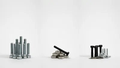 Assorted Metal Bolts Nuts and Washers on White Background