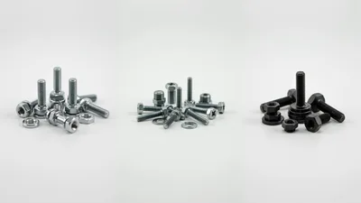 Assorted Metal Bolts and Nuts on White Background