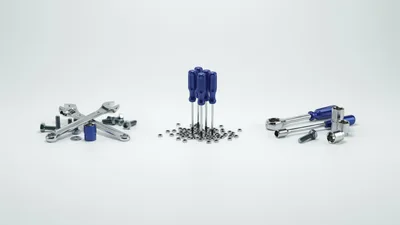 Assorted Hand Tools And Hardware On White Background