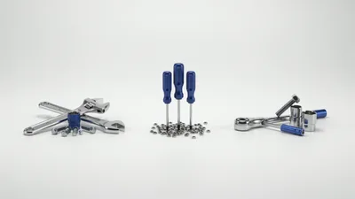 Assorted Mechanical Tools And Hardware On White Background