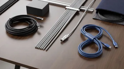 Organized Tech Accessories And Cables On Wooden Desk