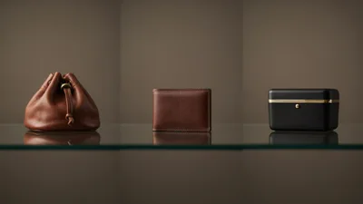 Luxury Leather Goods Displayed on Glass Shelf