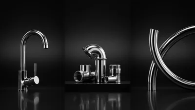 Chrome Plumbing Fixtures and Pipes on Black Background