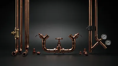 Copper Plumbing Pipes and Valves on Dark Background
