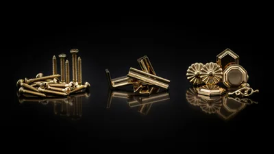 Gold Furniture Hardware Components on Black Reflective Surface