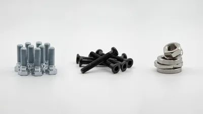 Assorted Metal Bolts and Nuts on White Background
