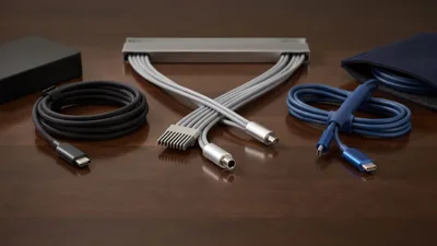 Assorted Tech Cables and Adapters on Wooden Table