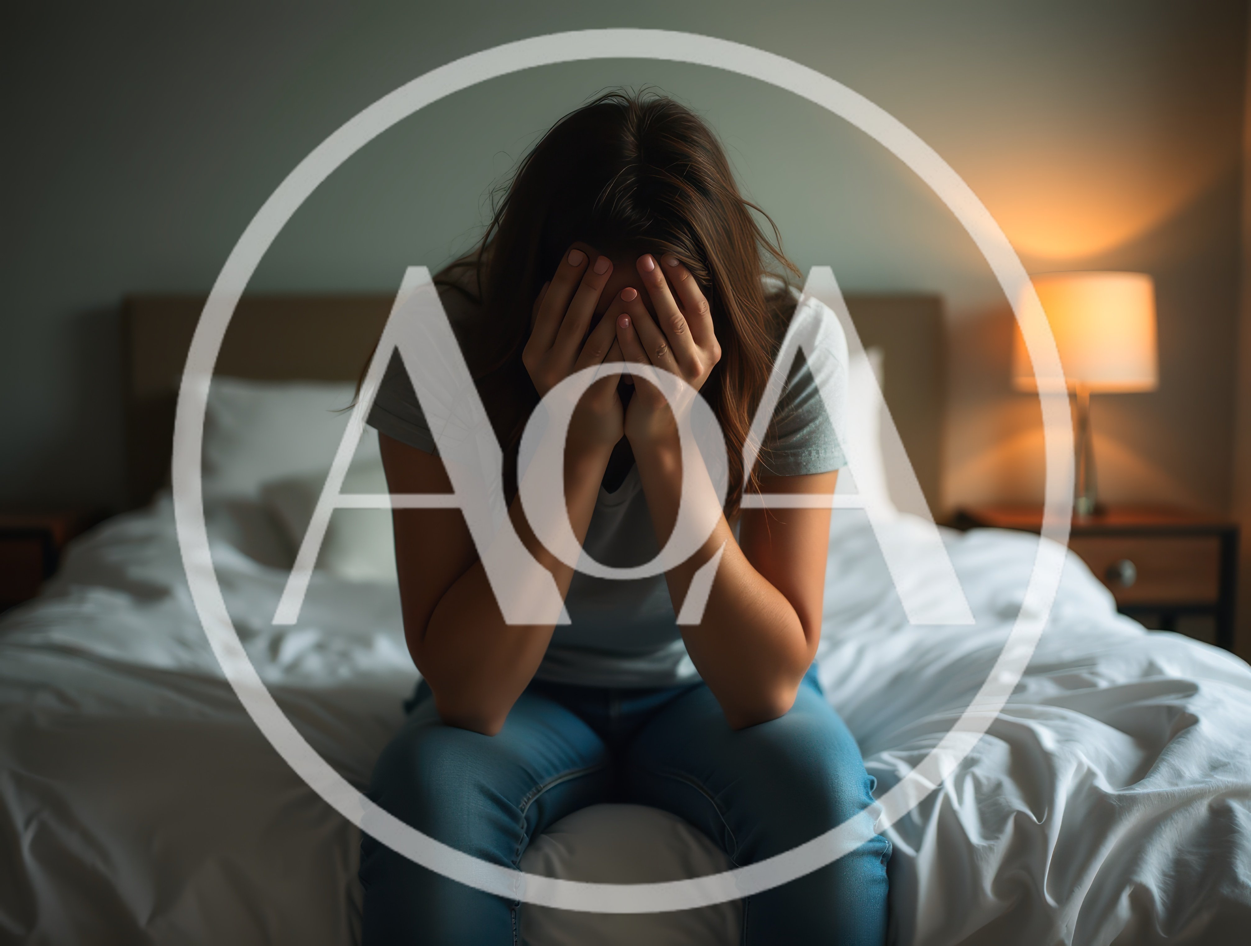Sad Woman Sitting On Bed Covering Face