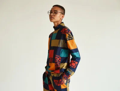 Androgynous Person Wearing Patterned Geometric Clothing