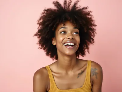 Portrait Of A Smiling Young Woman With Curly Hair