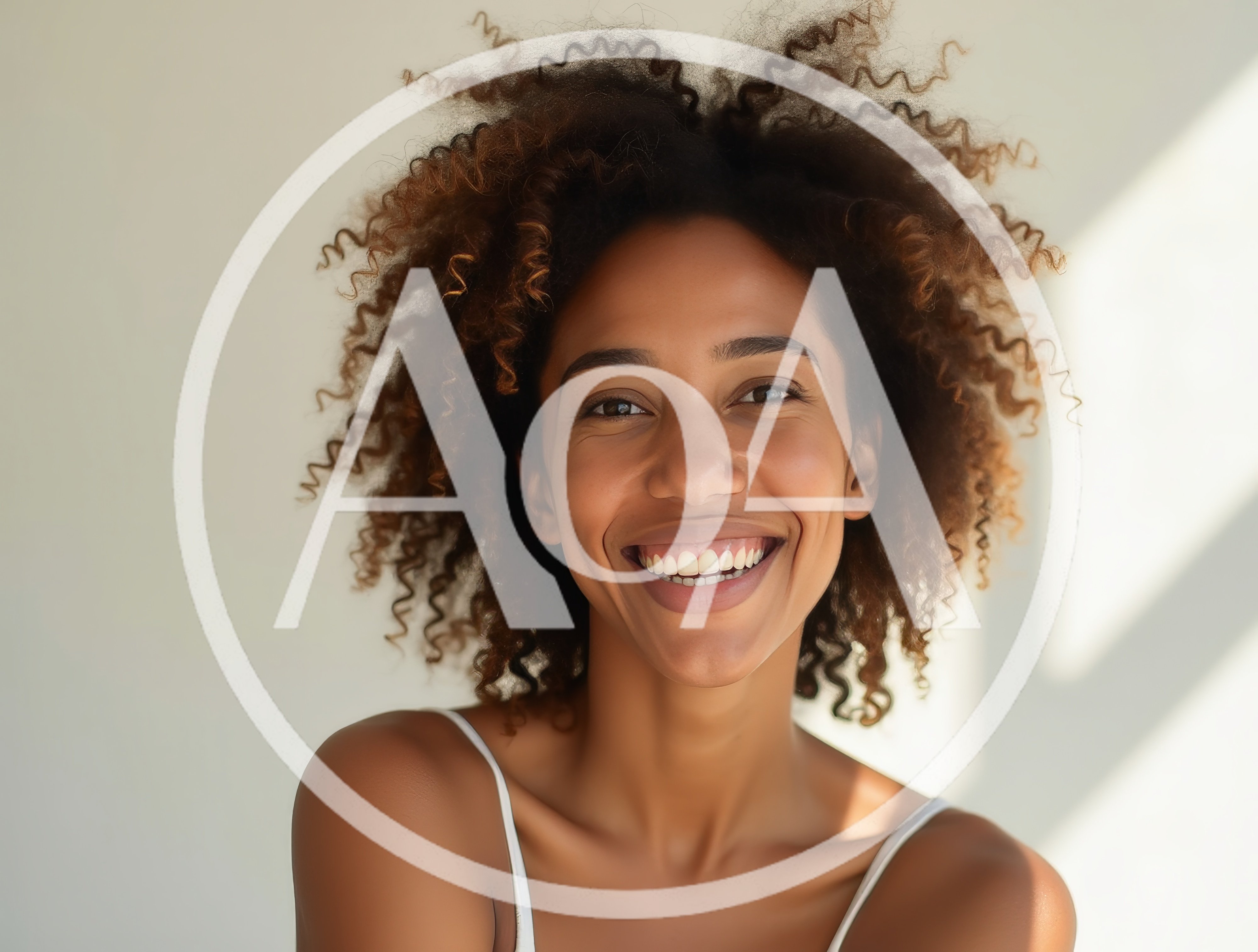 Portrait Of A Smiling Woman With Curly Hair
