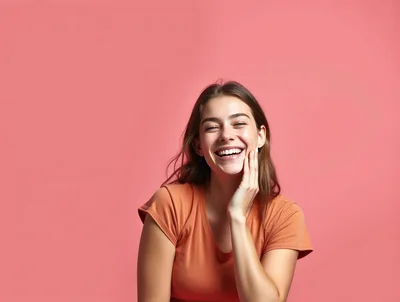 Happy Young Woman Smiling Against Pink Background