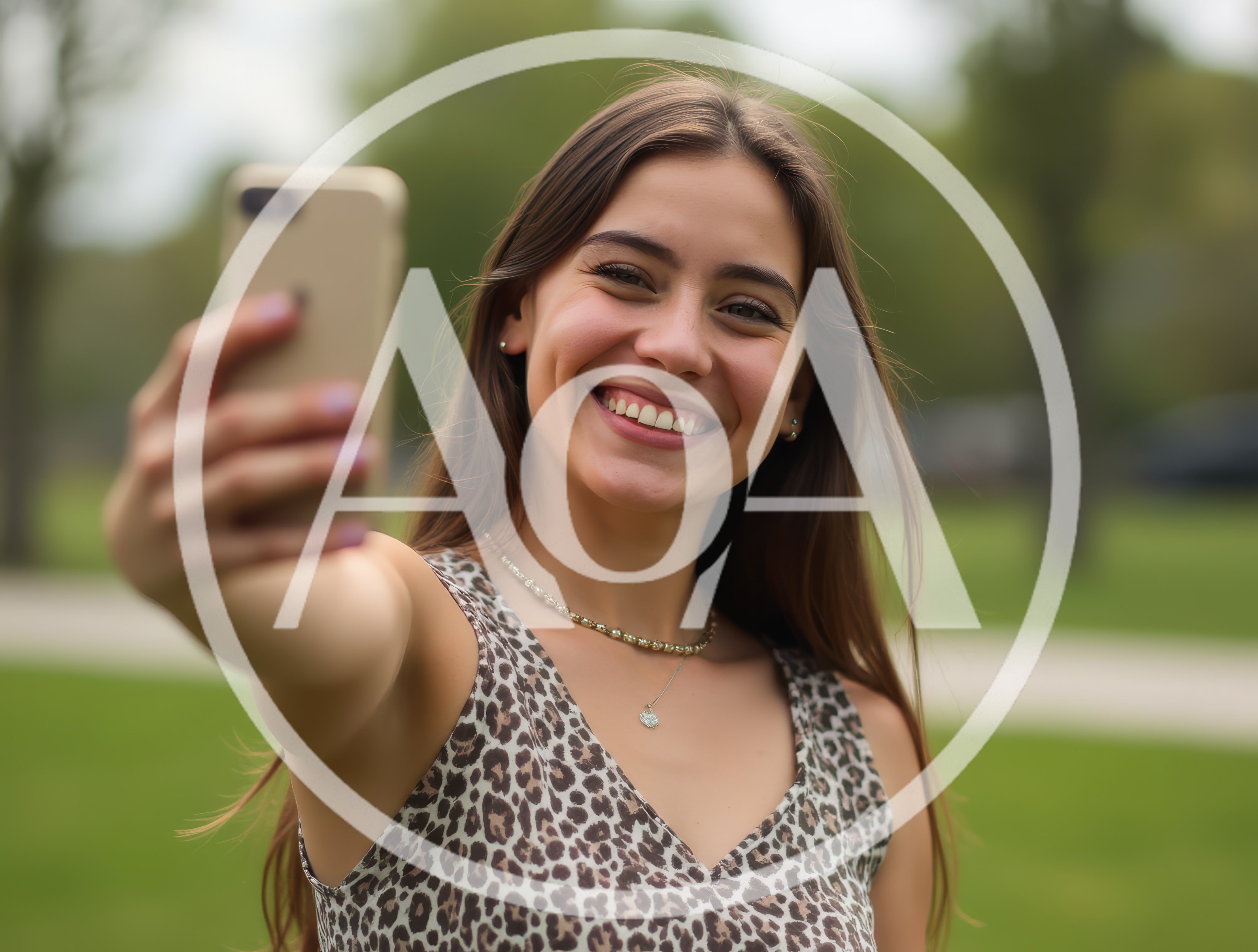 Young Woman Taking A Selfie In A Park