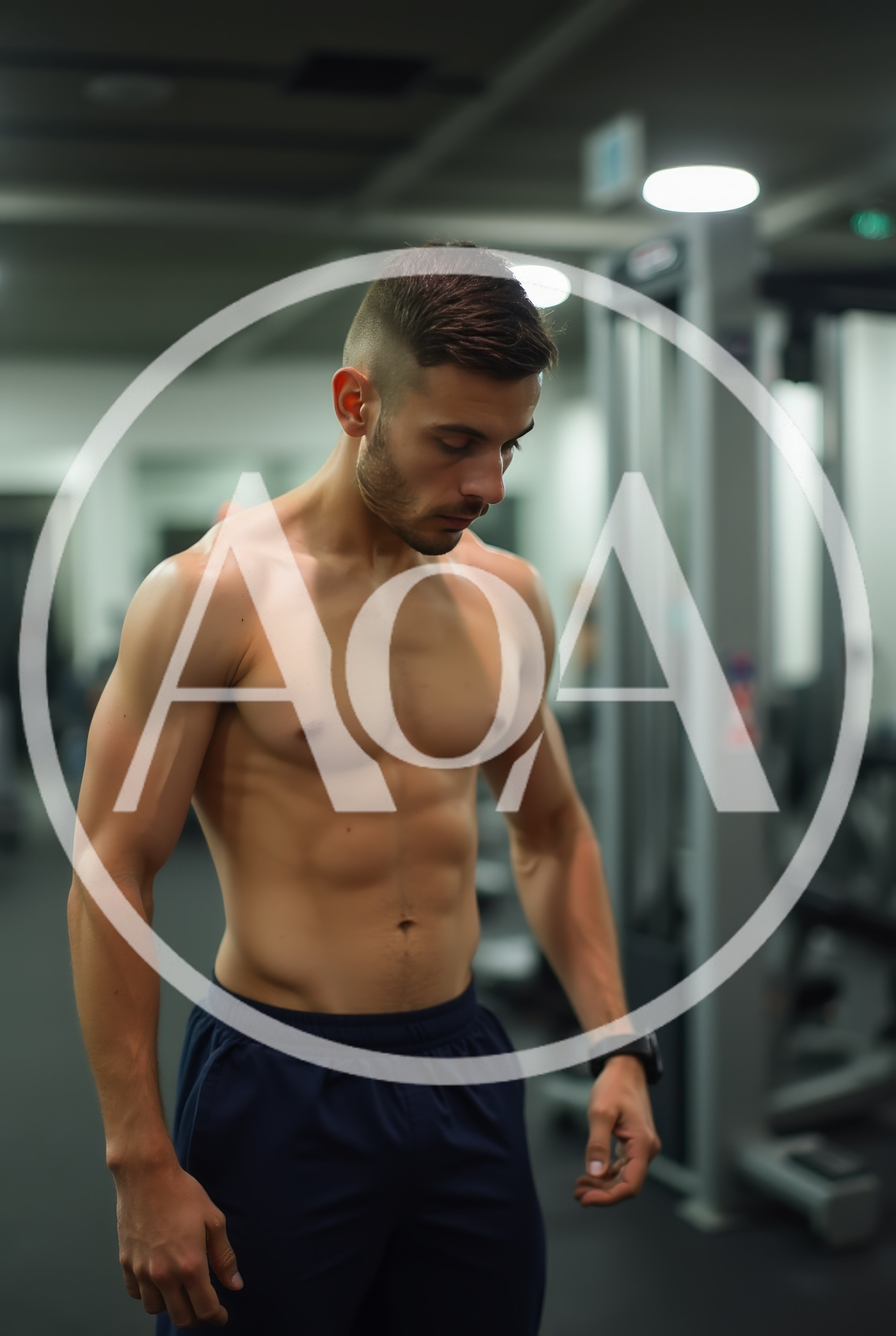 Shirtless Athletic Man Standing In A Modern Gym