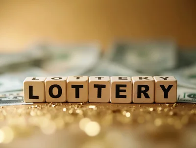 Wooden Blocks Spelling Lottery With Cash Background