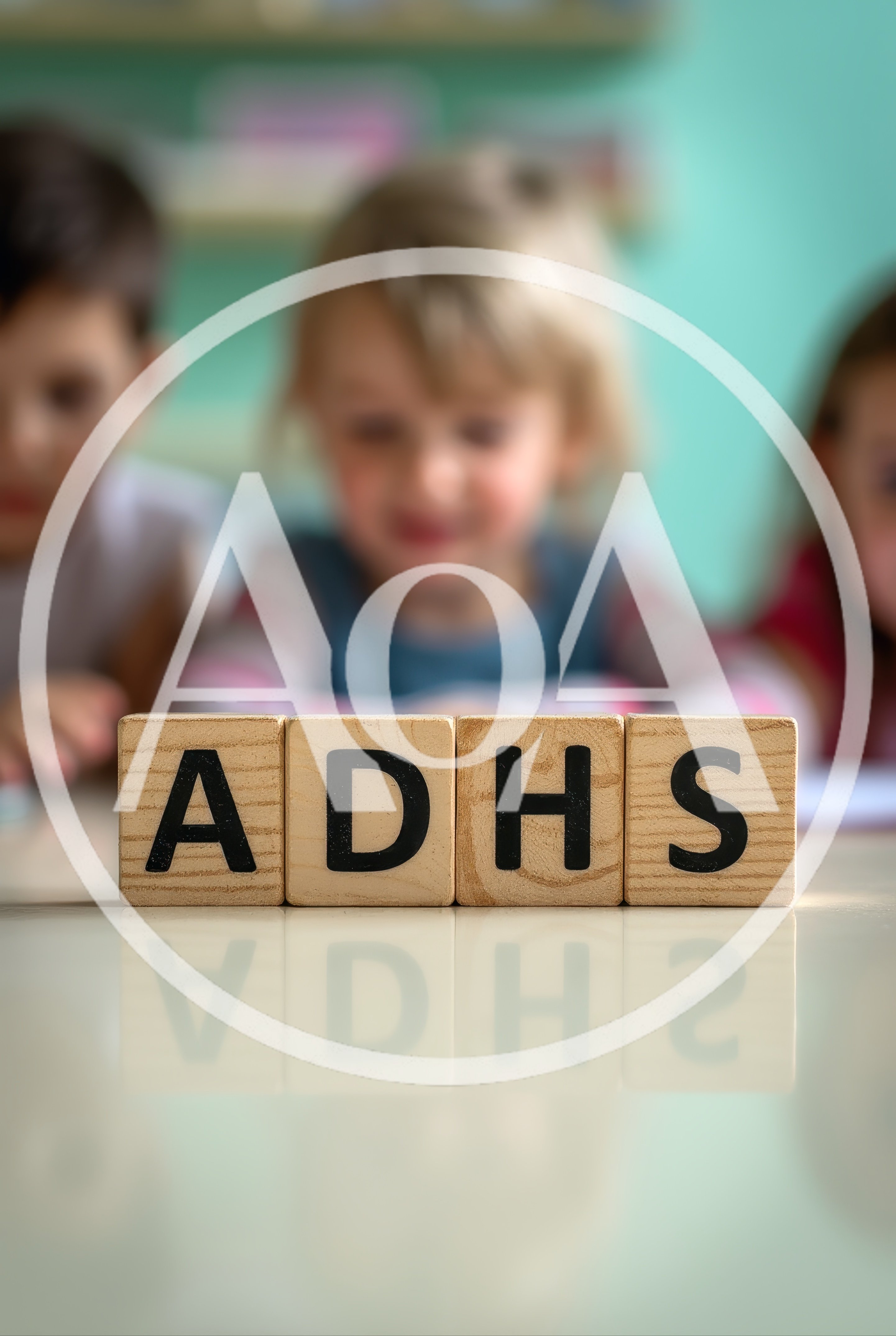 Wooden Blocks Spelling ADHS With Blurred Children In Background
