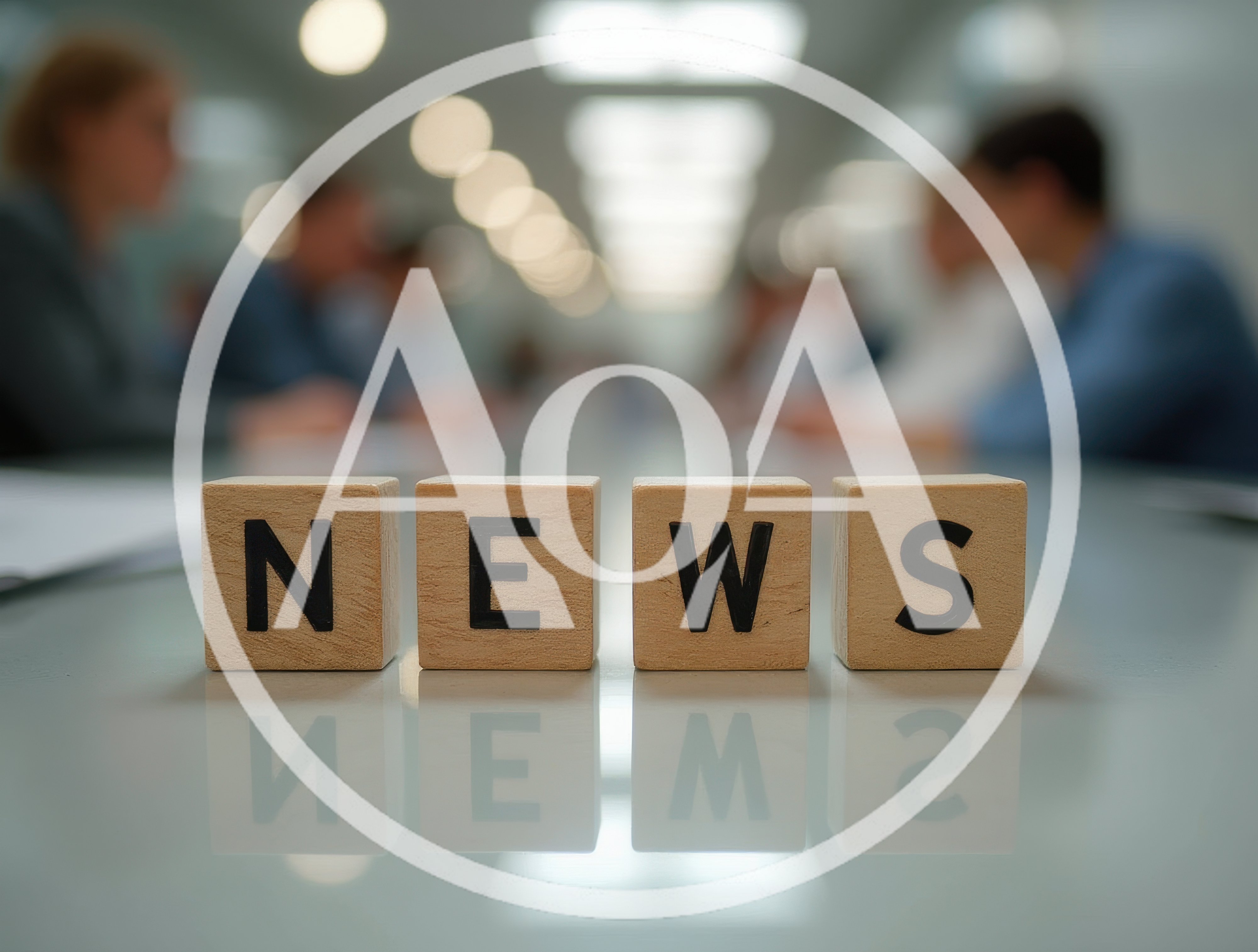 Wooden Blocks Spelling News on a Conference Table
