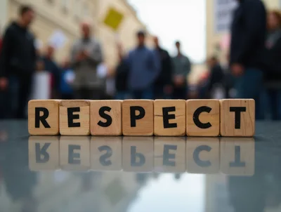 Wooden Blocks Spelling Respect With Blurred Crowd Background