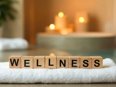 Wooden Blocks Spelling Wellness on a White Towel