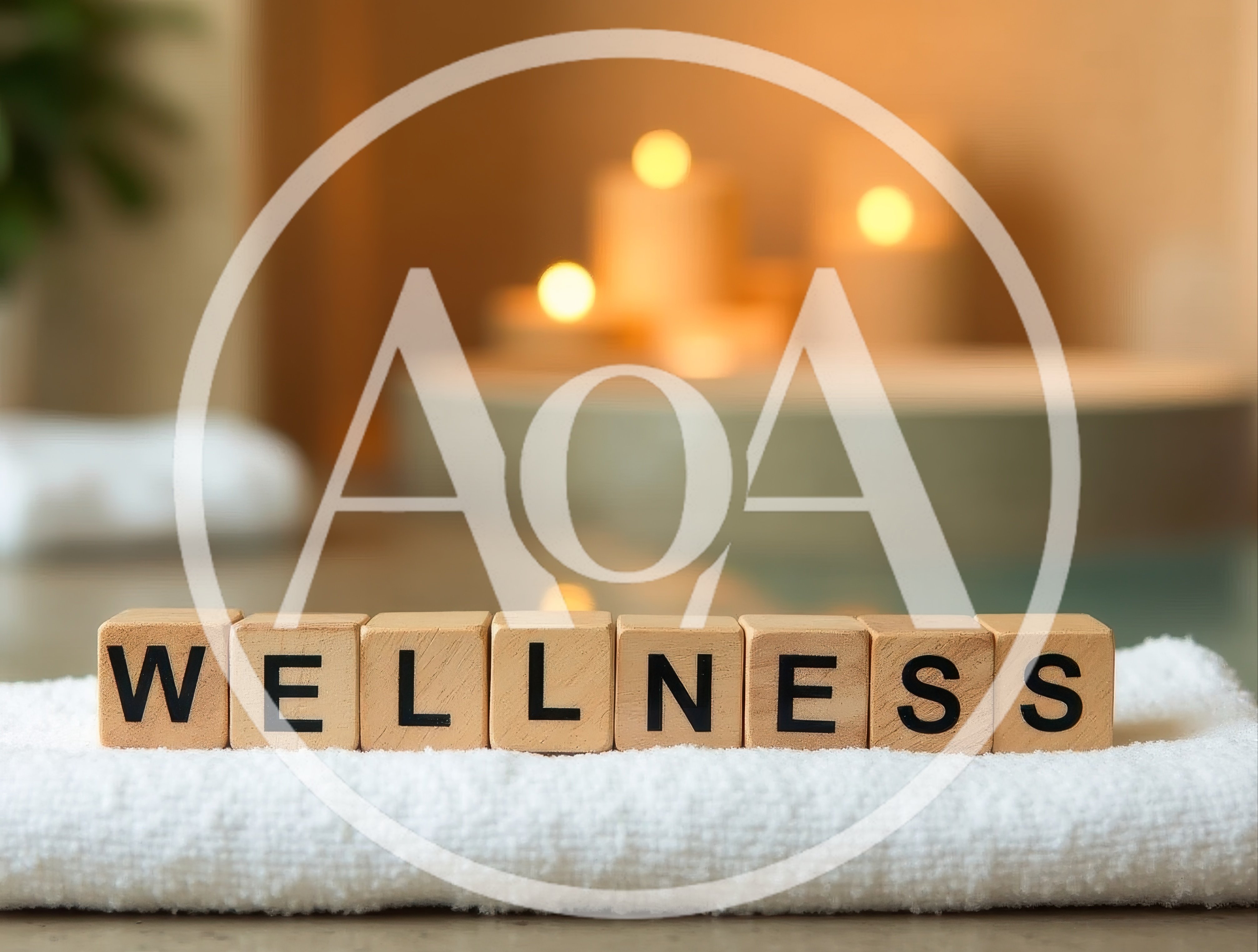 Wooden Blocks Spelling Wellness on a White Towel