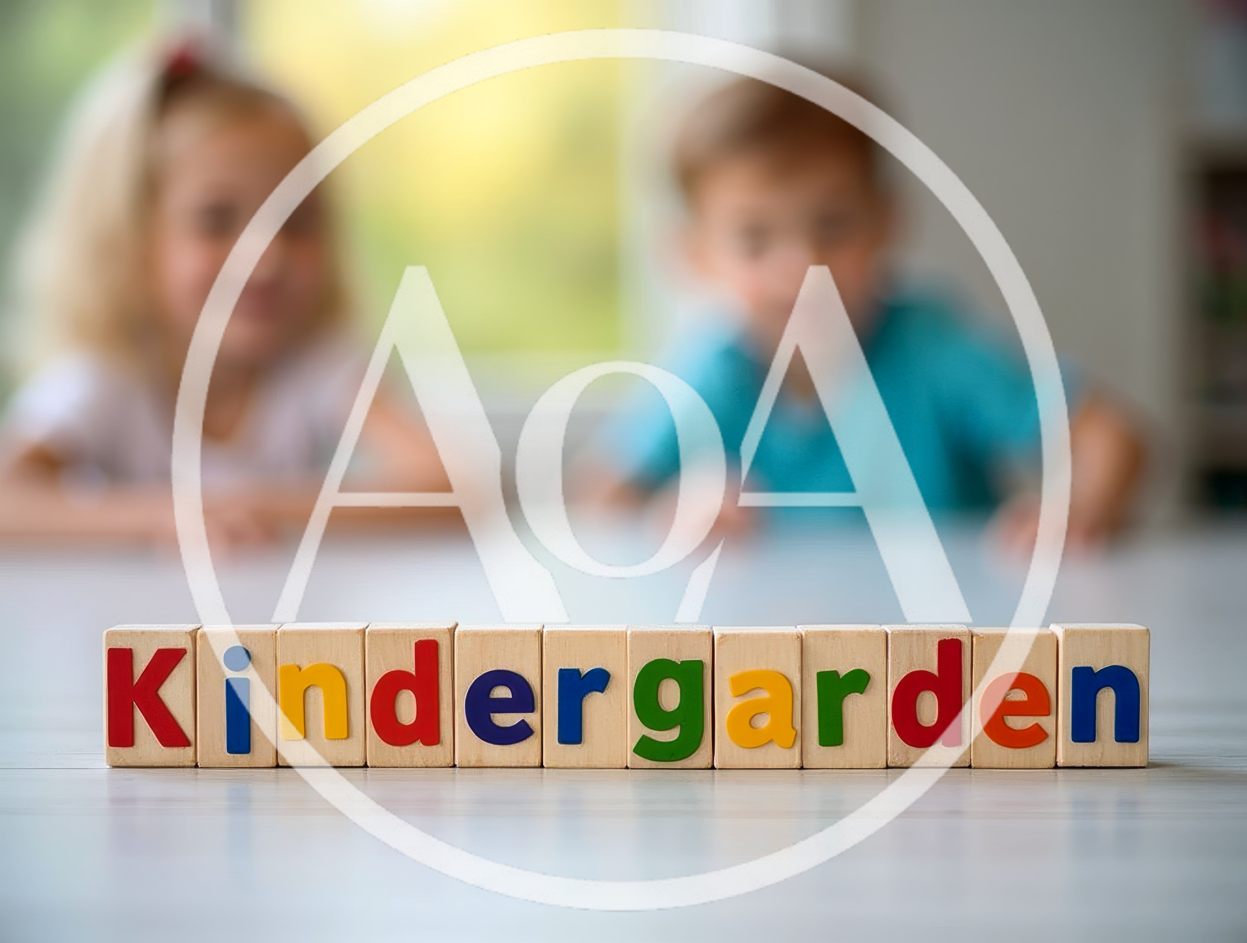 Wooden Blocks Spelling Kindergarten With Blurred Children In Background