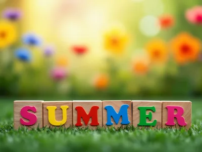 Colorful Summer Wooden Blocks on Green Grass