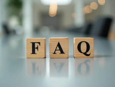 Wooden Blocks Spelling FAQ on a Reflective Table
