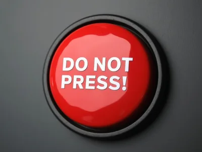 Red Do Not Press Button On Dark Background