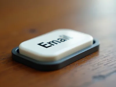 White Email Button On A Wooden Surface