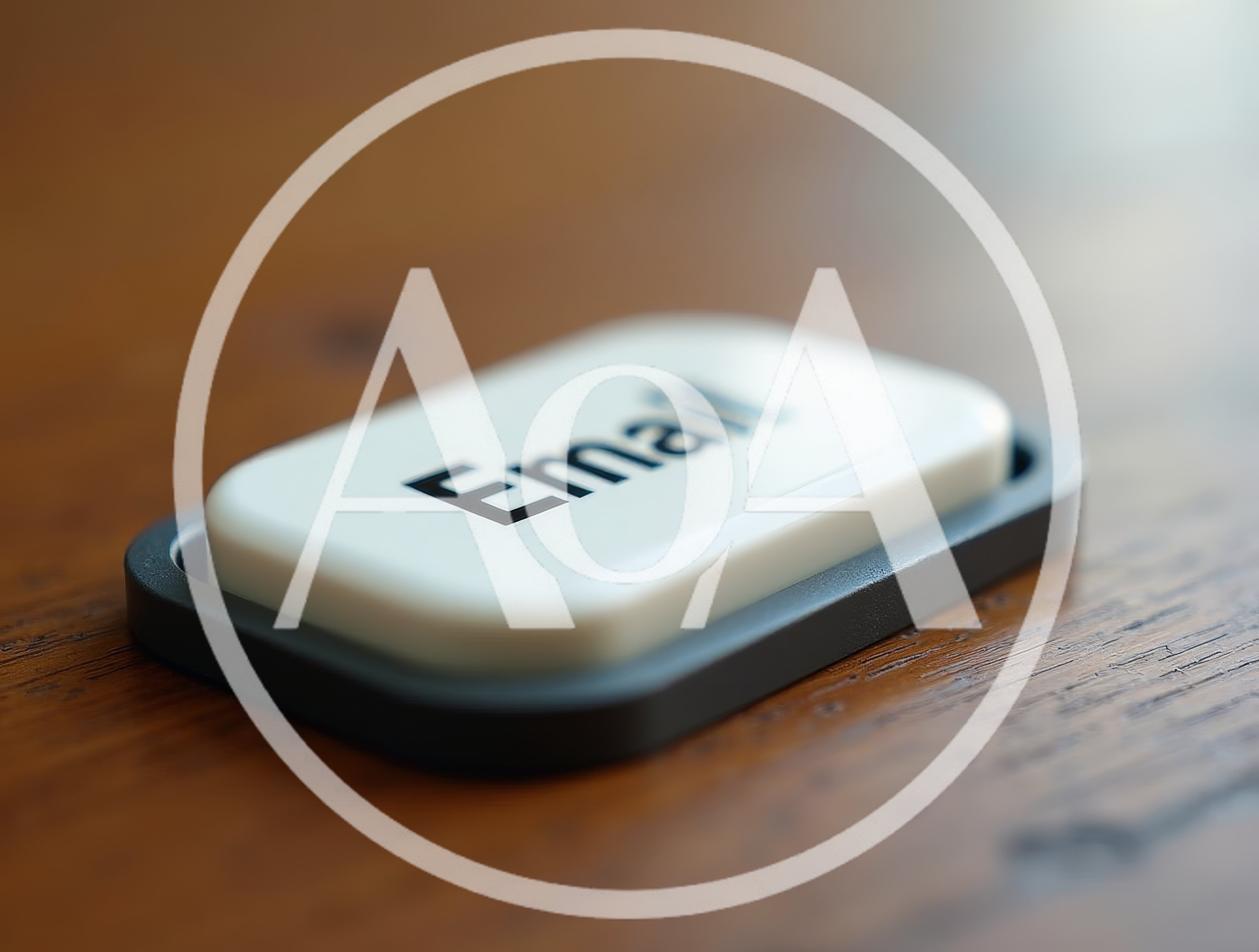 White Email Button On A Wooden Surface