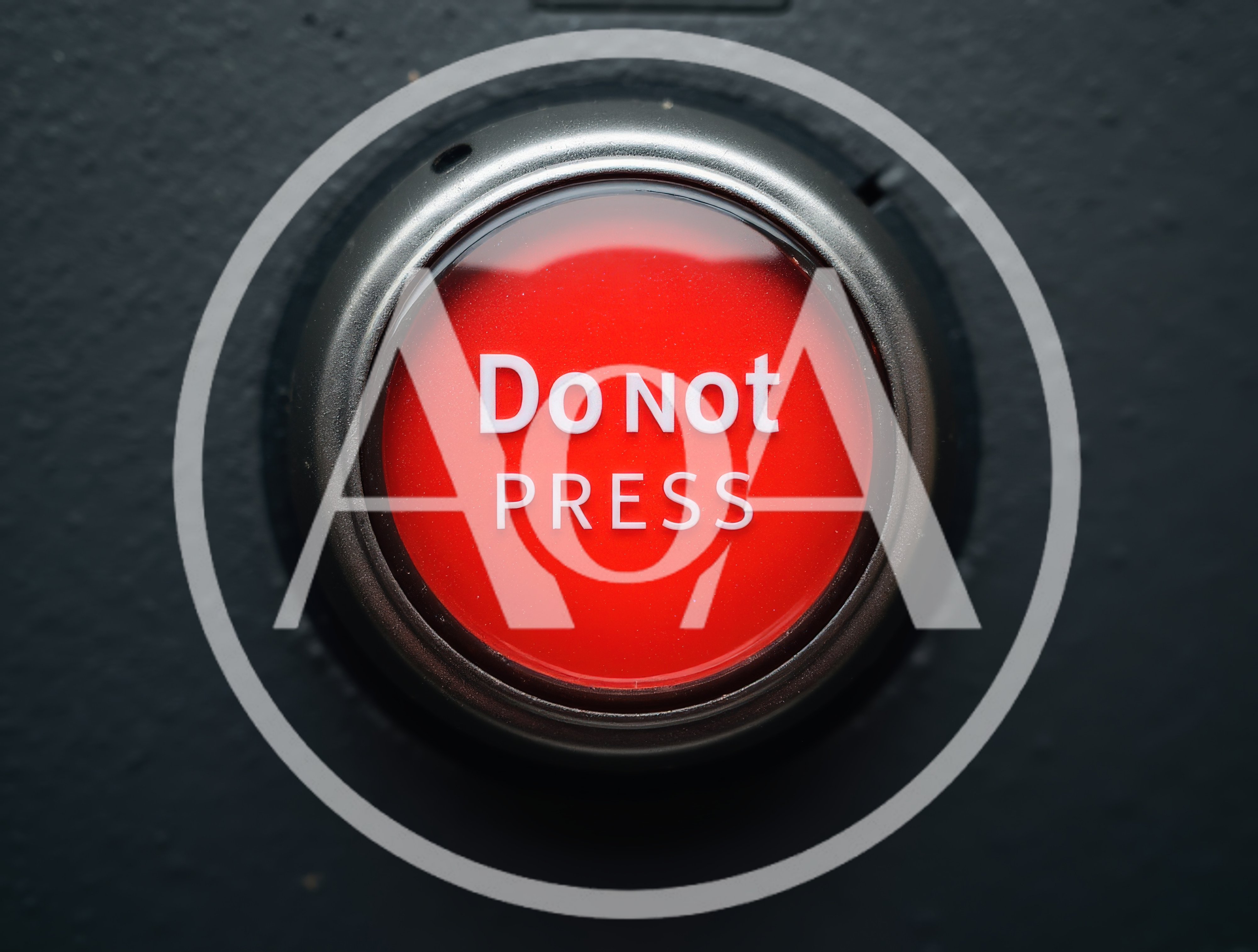 Red Do Not Press Button On Dark Surface