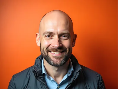 Portrait Of A Smiling Bald Man With A Beard