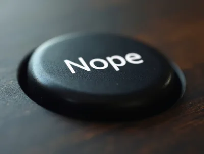 Close Up Of A Black Nope Button