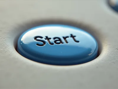 Macro Close Up Of A Blue Start Button