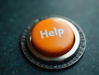 Orange Help Button On A Metallic Base