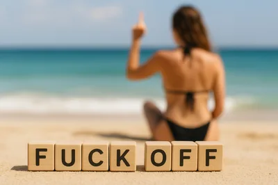 Wooden Blocks Spelling Fuck Off on Beach