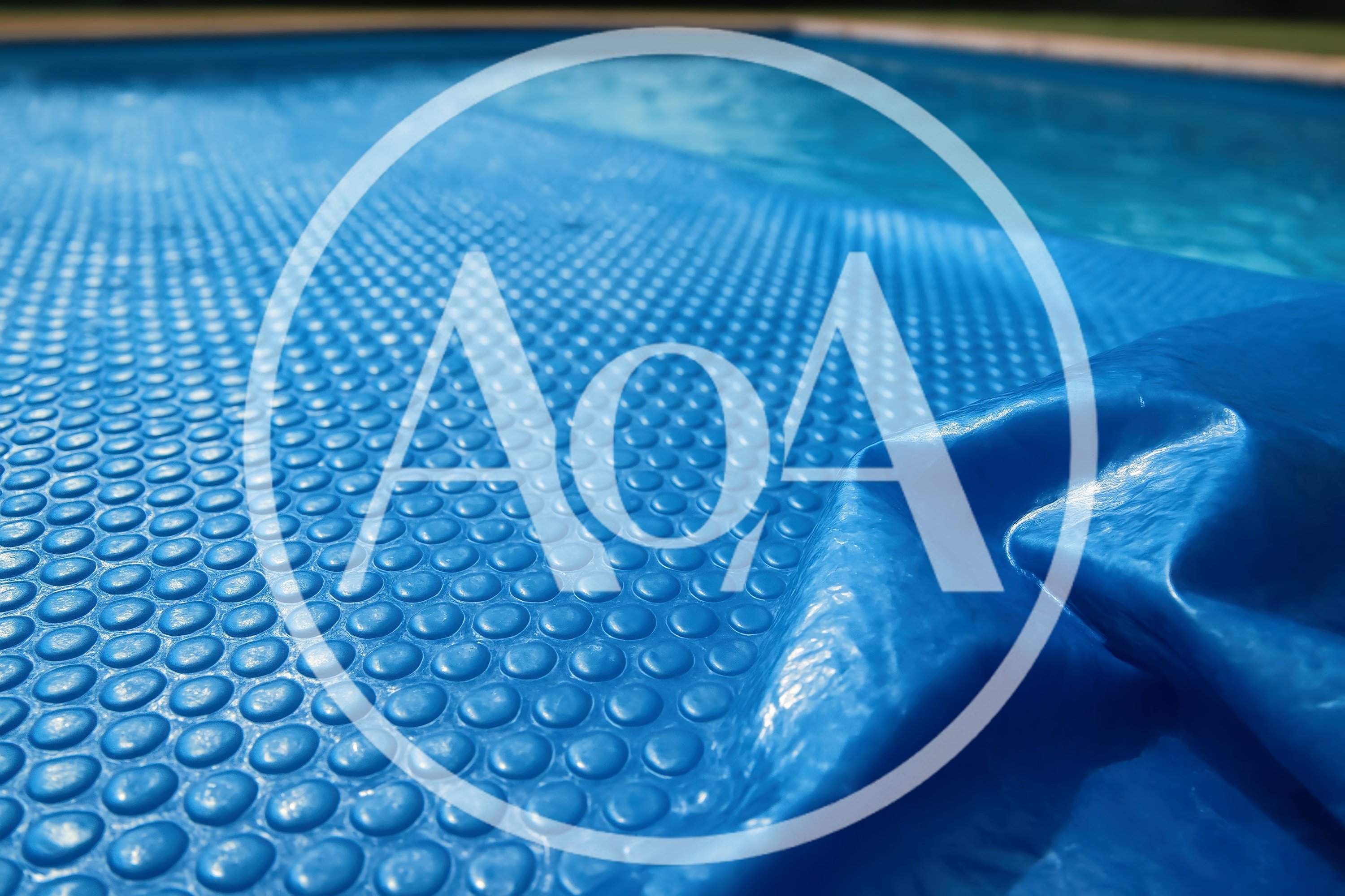 Blue Solar Pool Cover Floating On Water