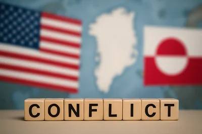Wooden Blocks Spelling Conflict With US and Greenland Flags