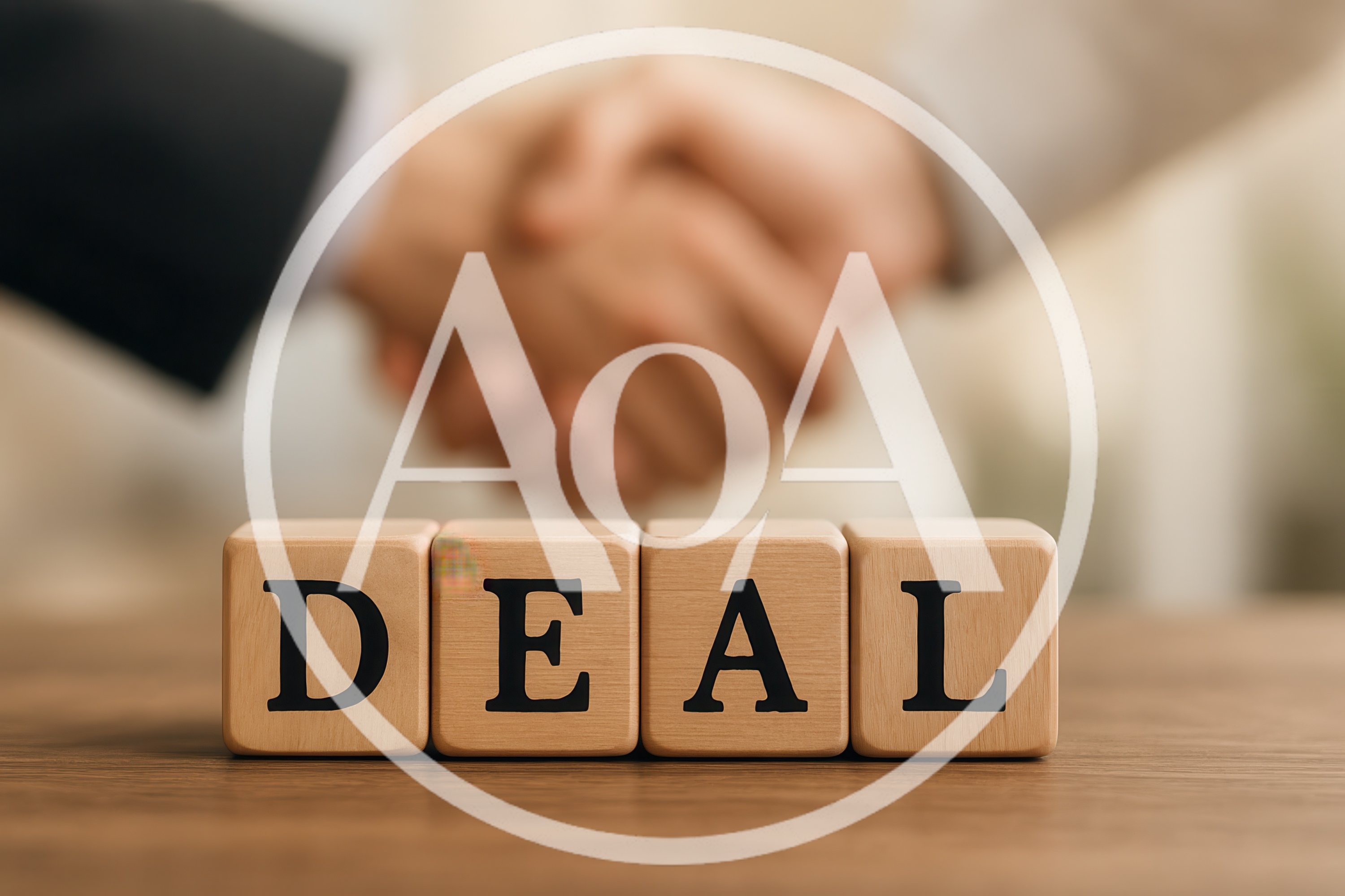 Business Partners Shaking Hands Over Wooden Deal Blocks