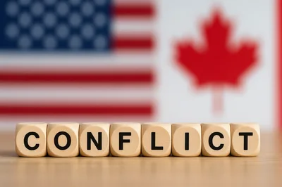 Wooden Blocks Spelling Conflict With US and Canadian Flags