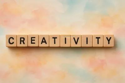 Wooden Letter Tiles Spelling The Word Creativity