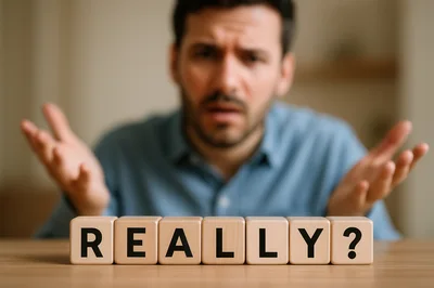 Frustrated Man Expressing Disbelief With Really Wooden Blocks